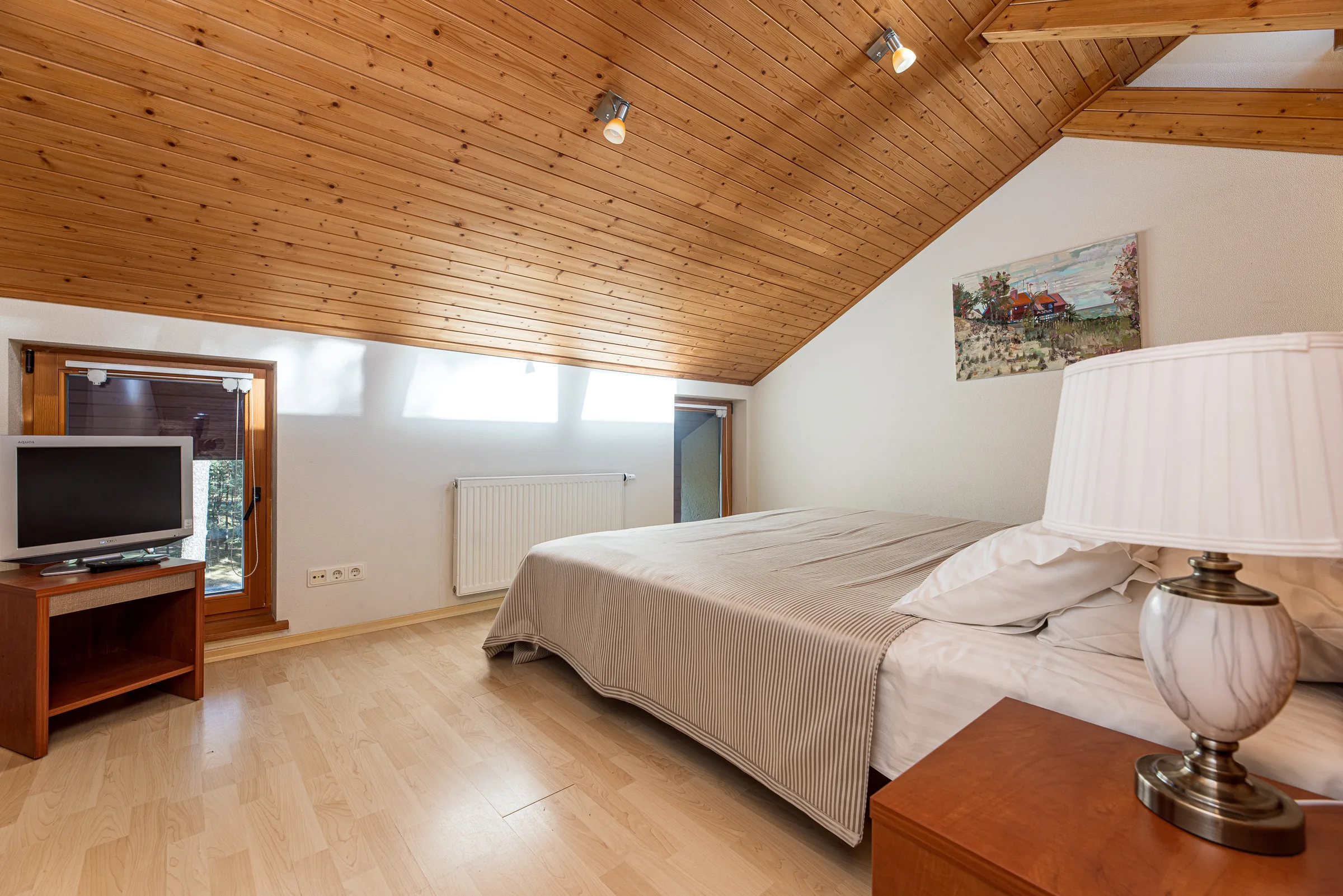 Attic bedroom with a TV